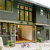 Back of the house showing the open Nano wall doors and back patio.